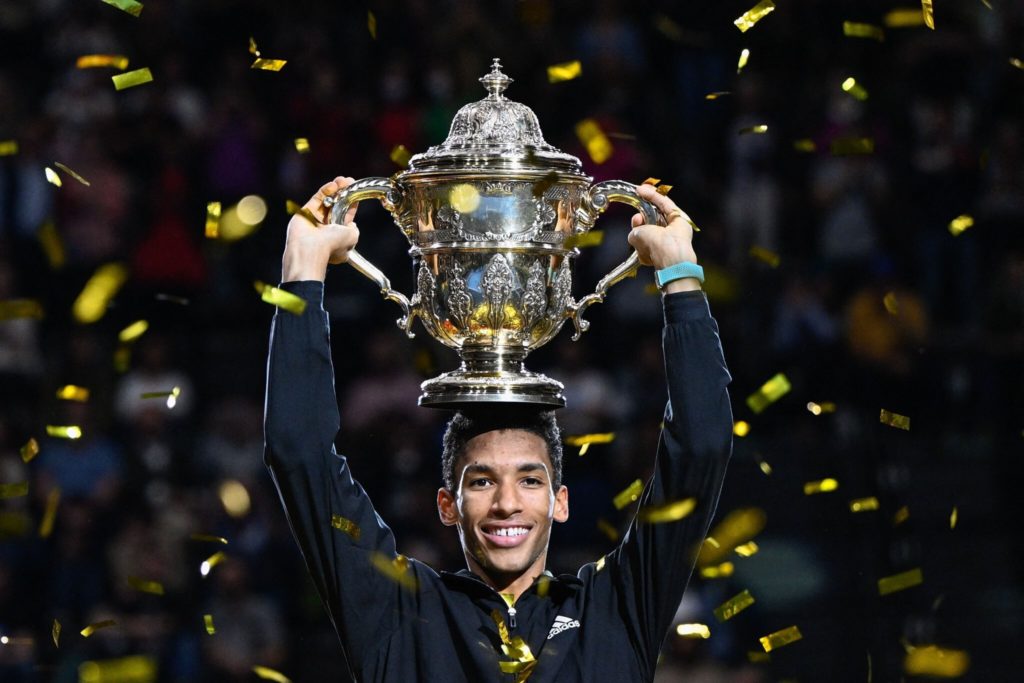 Felix Auger-Aliassime holds the Basel trophy