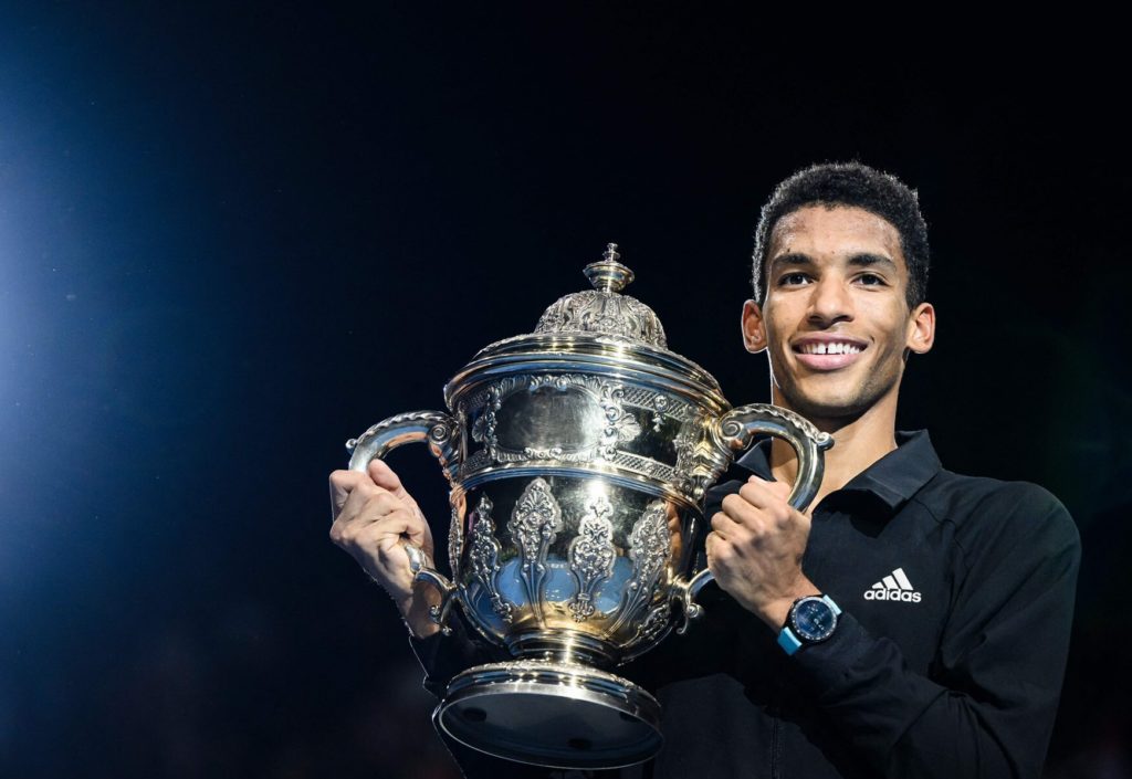 Felix Auger-Aliassime holds the Basel trophy