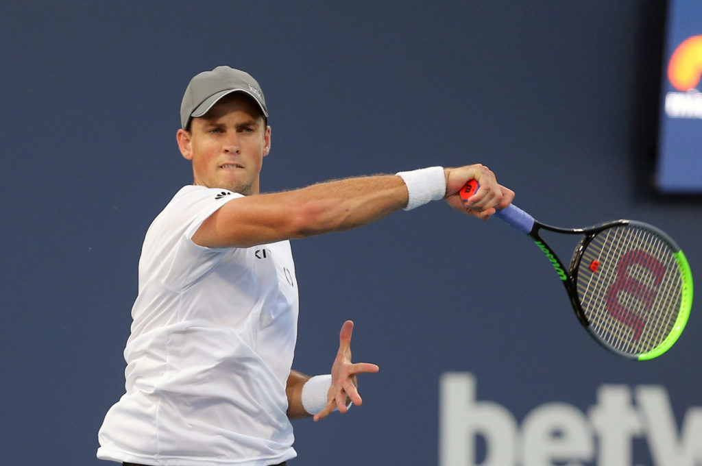 Vasek Pospisil follows through on a forehand.