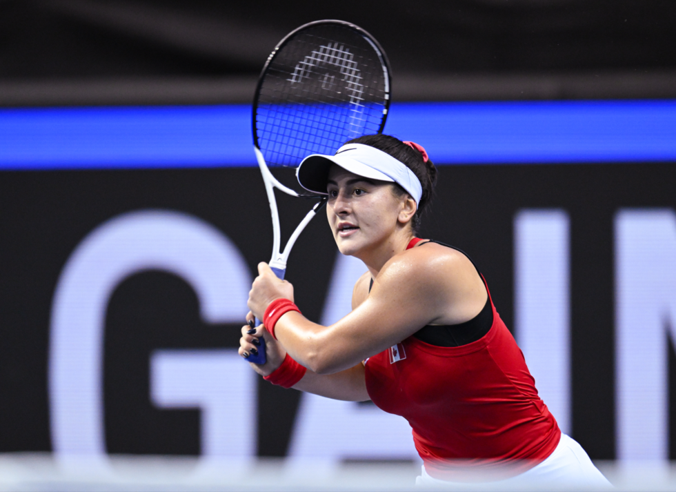 Bianca Andreescu follows through on a backhand.