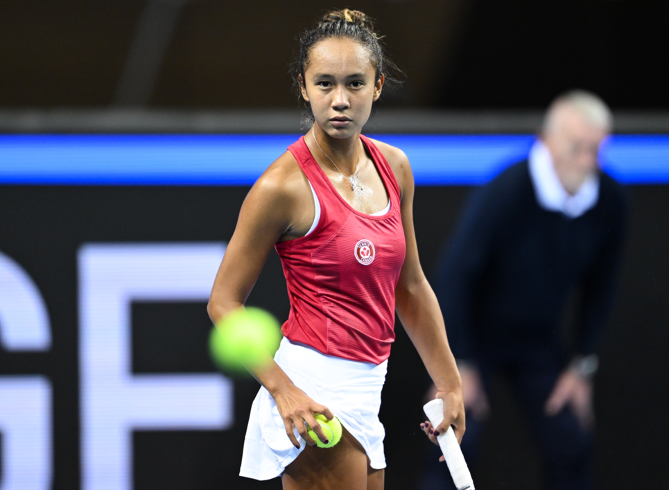 Leylah Fernandez stares at the ball.