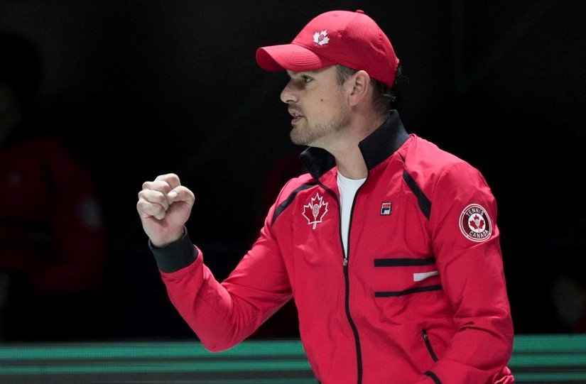Frank Dancevic raises his fist in celebration of a point won