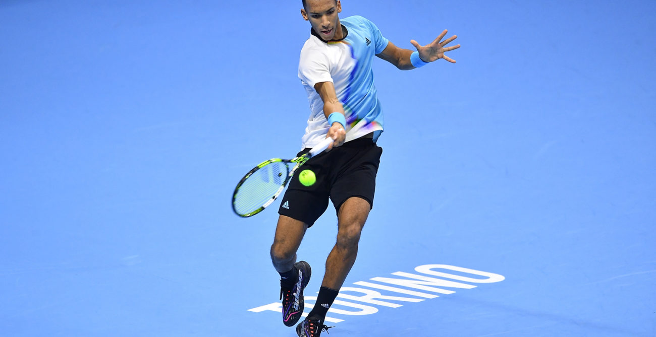 Felix Auger-Aliassime hits a forehand.