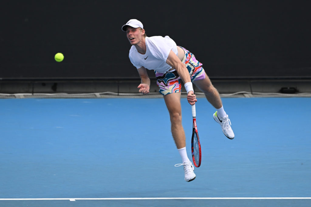 Denis Shapovalov follows through on a serve.