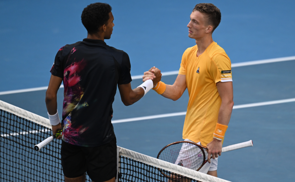Felix Auger-Aliassime and Jiri Lehecka shake hands.