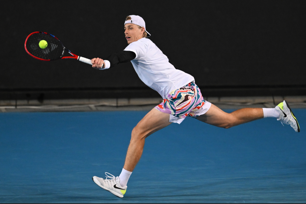 Denis Shapovalov follows through on a backhand