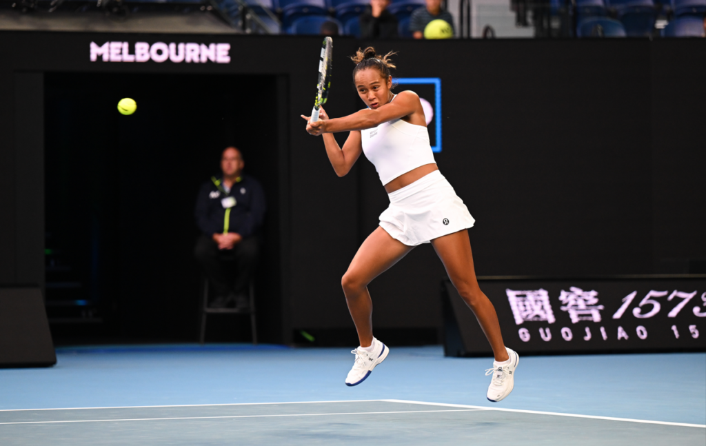 Leylah Fernandez leaps to hit a forehand.