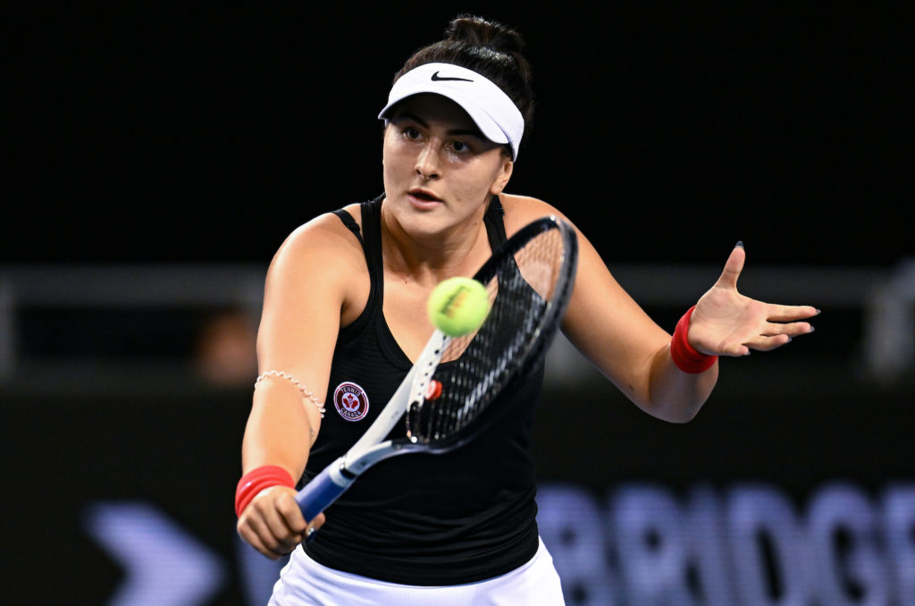 Bianca Andreescu hits a backhand volley.