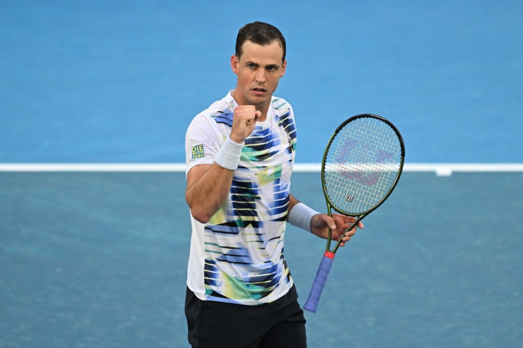 Vasek Pospisil pumps his fist.