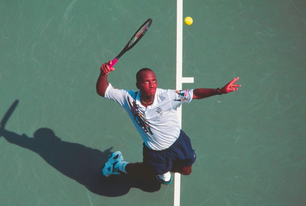 MaliVai Washington about to hit a serve.
