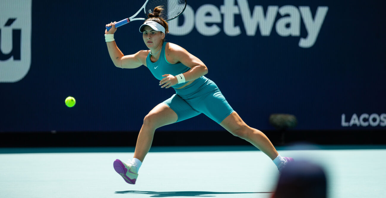 Bianca Andreescu lunges and prepares to hit a forehand.