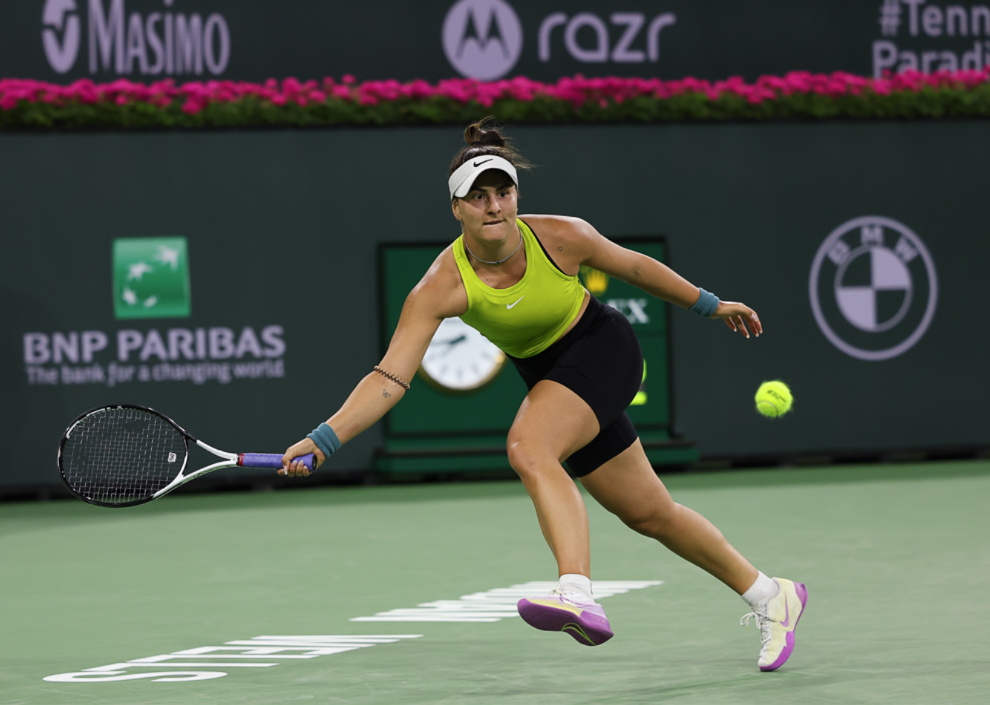 Bianca Andreescu lunges for a forehand.