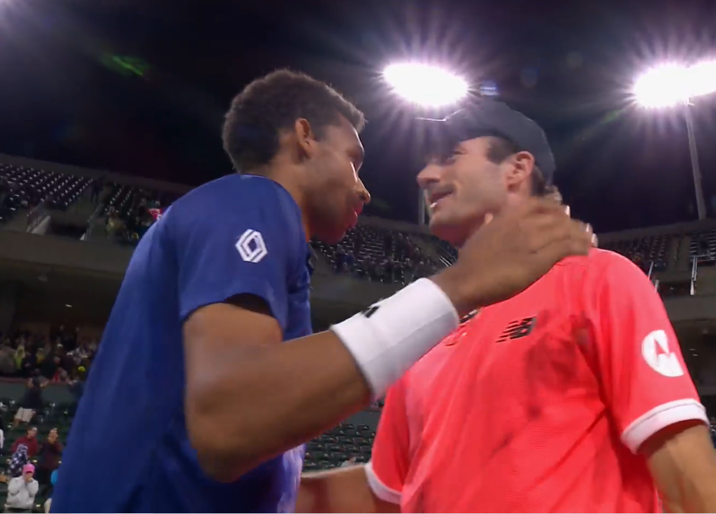 Felix Auger-Aliassime and Tommy Paul embrace at the end.