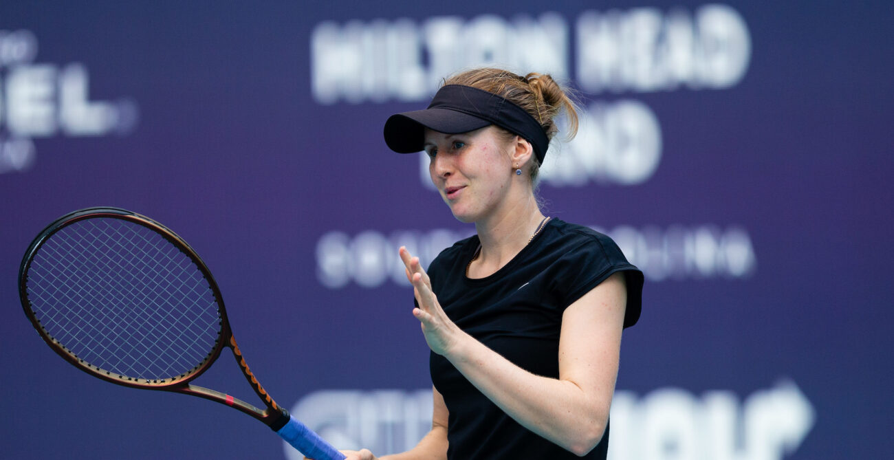 Katherine Sebov raises her hands and gestures.