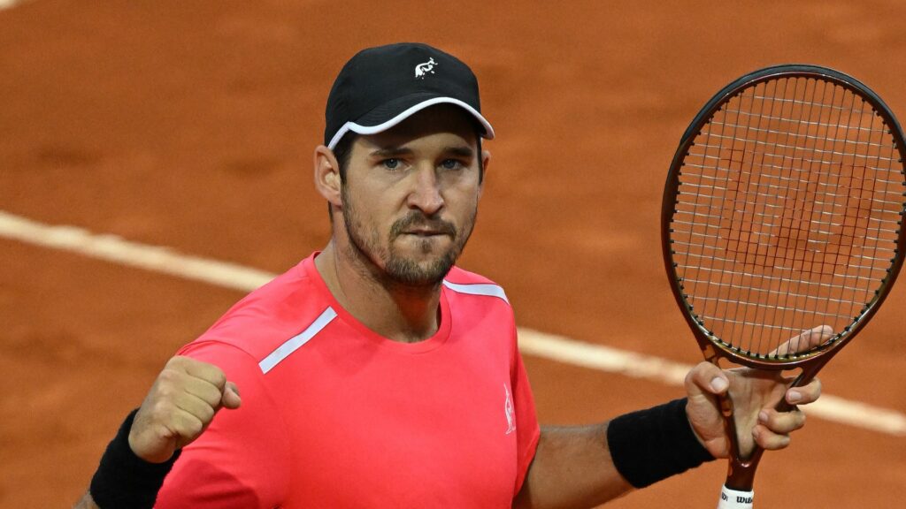 Dusan Lajovic pumps his fist.