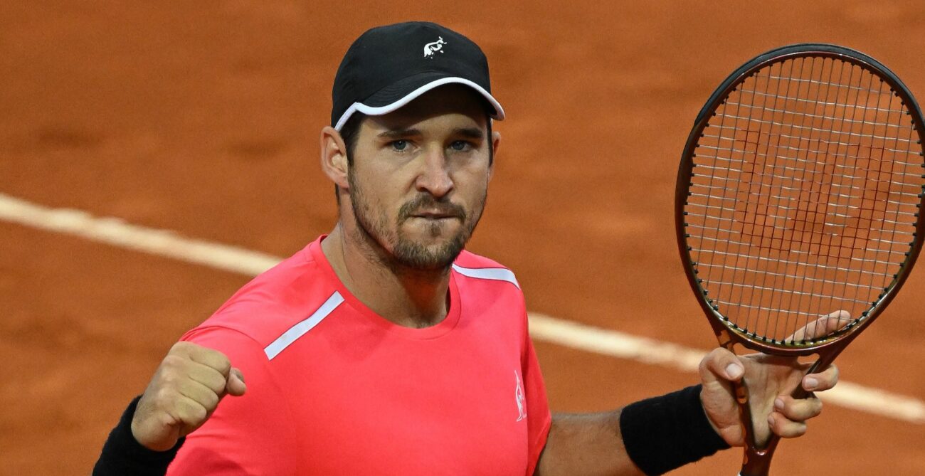 Dusan Lajovic pumps his fist.