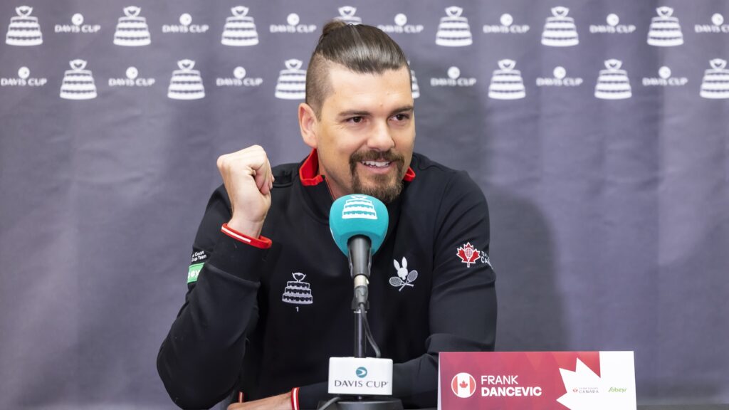 Frank Dancevic smiles behind the microphone at his Davis Cup press conference.
