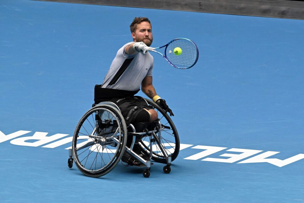 Rob Shaw hits a backhand.