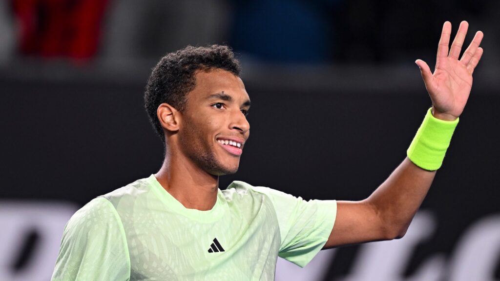 Felix Auger-Aliassime waves to the crowd. He advanced to the Montpellier semifinals with a win on Friday.