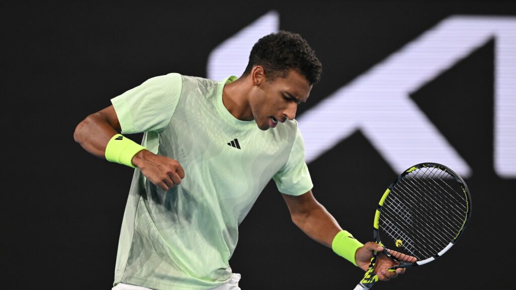 Felix Auger-Aliassime winds up to pump his fist. He and Denis Shapovalov won their opening matches in Indian Wells.