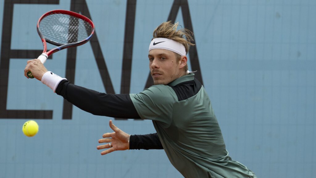 Denis Shapovalov reaches to hit a backhand in Madrid. He lost to Alexander Zverev on Sunday.