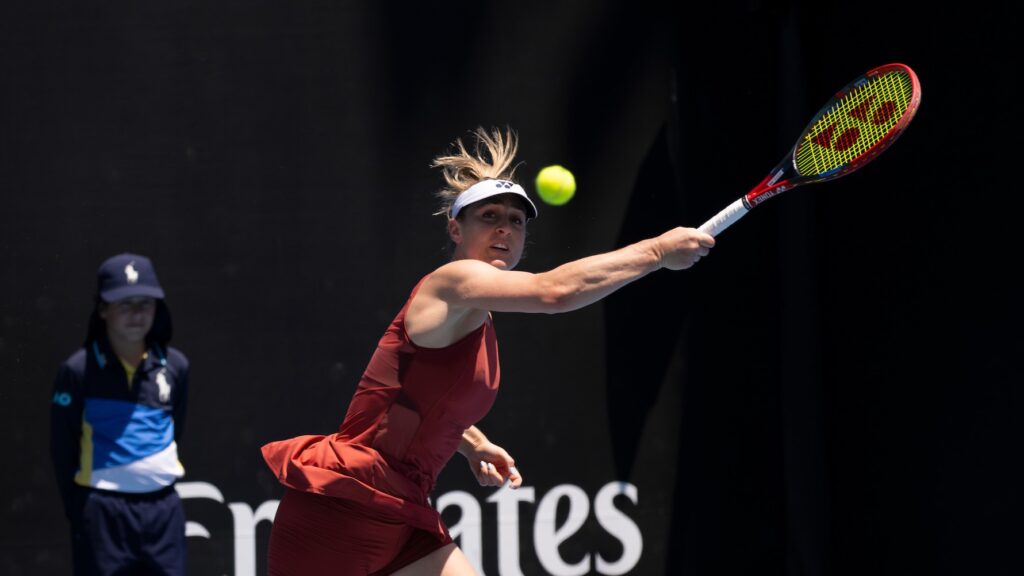 Gabriela Dabrowski follows through on a forehand at the Australian Open.