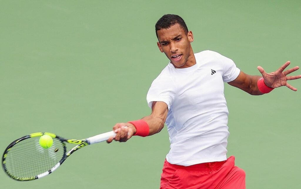 Felix Auger-Aliassime hits a forehand in Dubai. He beat Quentin Halys in the semifinals on Friday.