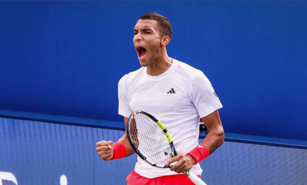 Felix Auger-Aliassime pumps his fists in Dubai. He beat Marin Cilic in the quarter-finals on Thursday.